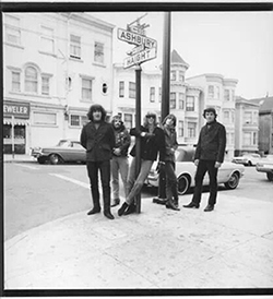 The Grateful Dead stand on the corner of Haight & Ashbury, 1966. Herb Greene (Courtesy Spe